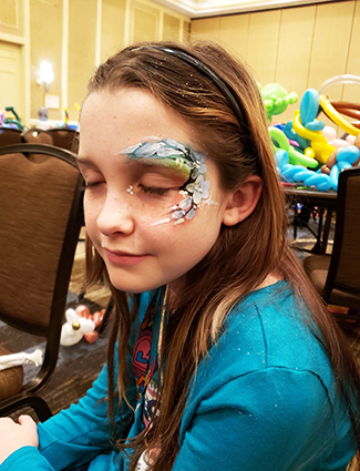 Girl with flower themed face paint