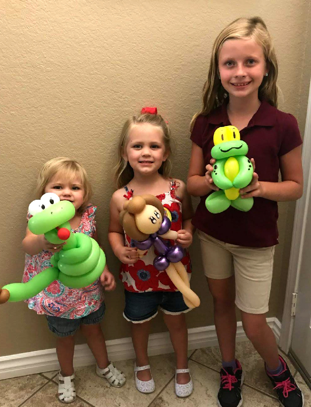 Three kids with balloons